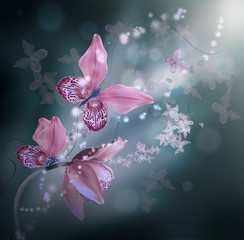 Amazing butterflies from the petals of orchids, floral background. Flowers and insects.