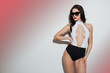 Portrait of a beautiful woman in sunglasses standing and posing Portrait of a beautiful woman in sunglasses standing and posing