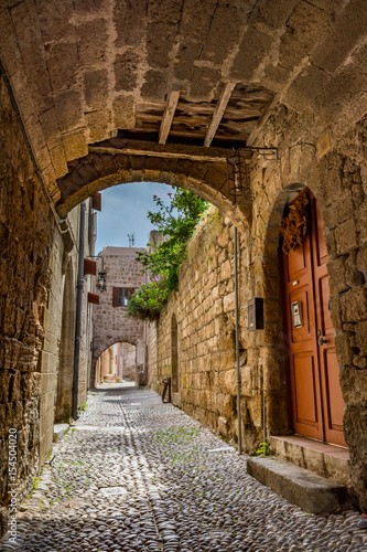 Charming narrow street in the old town of Rhodes, Rhodes island, Greece