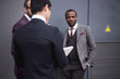 business people discussing work together near modern office building business people discussing work together near modern office building