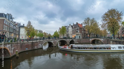 Amsterdam city skyline day to night timelapse at canal waterfront, Amsterdam, Netherlands, 4K Time Lapse