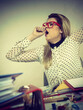 Sleepy business woman in office working yawning Sleepy business woman in office working yawning