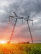 Power pylons and high voltage lines in an agricultural landscape Power pylons and high voltage lines in an agricultural landscape