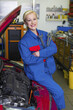 woman as a mechanic in auto repair shop woman as a mechanic in auto repair shop
