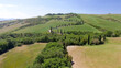 Amazing aerial view of Tuscany countryside winding road in spring season - Italy Amazing aerial view of Tuscany countryside winding road in spring season - Italy