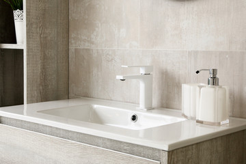 modern and clean toilet, sink and toiletries