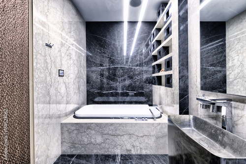  Black-and-white marble in the interior of a modern bathroom in a luxury apartment.