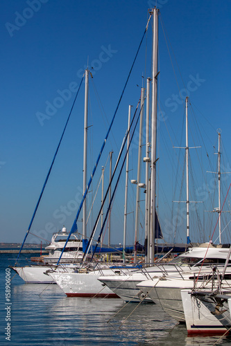  yachts moored in a marina.
