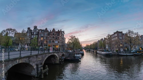 Amsterdam city skyline day to night timelapse at canal waterfront, Amsterdam, Netherlands, 4K Time Lapse