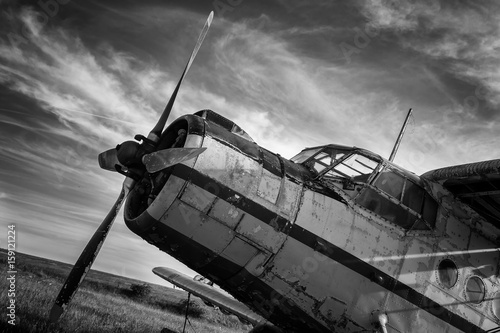  Old airplane on field in black and white