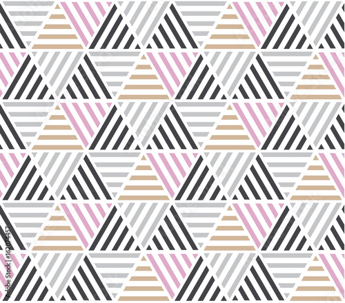  Modern style vector illustration for surface design. Abstract seamless pattern with triangle motif in natural beige and gray colors.