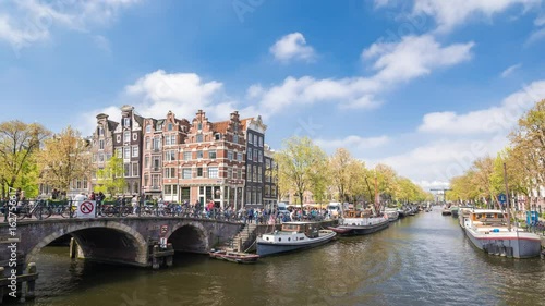 Amsterdam city skyline timelapse at canal waterfront, Amsterdam, Netherlands, 4K Time Lapse