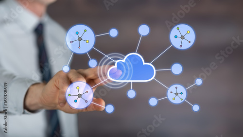 Man touching a cloud networking on a touch screen