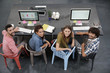 Upper view of start-up people working in open co-working office Upper view of start-up people working in open co-working office