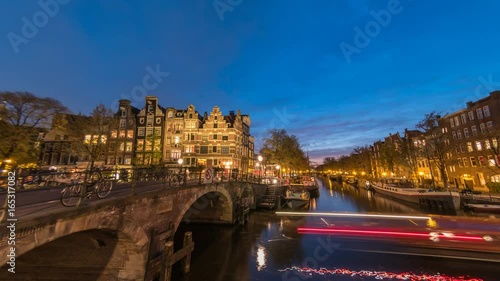 Amsterdam city skyline day to night timelapse at canal waterfront, Amsterdam, Netherlands, 4K Time Lapse