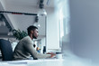 Young african man working in office Young african man working in office