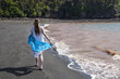Woman strolling along Black Beach, Lorneville, New Brunswick, in Atlantic Canada Woman strolling along Black Beach, Lorneville, New Brunswick, in Atlantic Canada