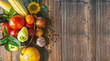 Vegetables in a wicker basket on a wooden table. Wide angle Vegetables in a wicker basket on a wooden table. Wide angle