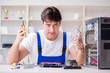 Computer repairman repairing desktop computer Computer repairman repairing desktop computer
