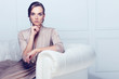 Fashion portrait of beautiful lady in gold evening dress Fashion portrait of beautiful lady in gold evening dress