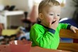 Yawning boy. Toys in the background. Child concept. Yawning boy. Toys in the background. Child concept.