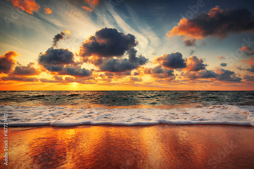 Beautiful sunrise over the sea and dramatic clouds