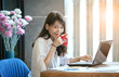 happiness smiling face of young asian woman drinking hot coffee as freelance working happiness smiling face of young asian woman drinking hot coffee as freelance working