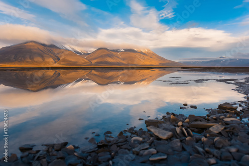 Landscape of a nature of a sunset with clouds in the mountains of Spitsbergen Svalbard near the Norwegian city Longyearbyen
