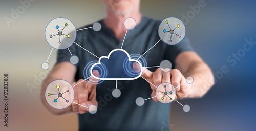 Man touching a cloud networking on a touch screen