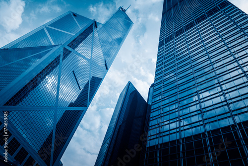 directly below of modern financial skyscrapers in central Hong Kong,blue toned,china.
