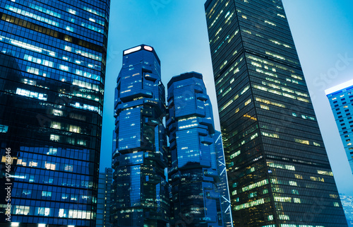 directly below of modern financial skyscrapers in central Hong Kong,blue toned,china.