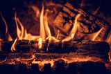 Wood in the flames of cozy fireplace
