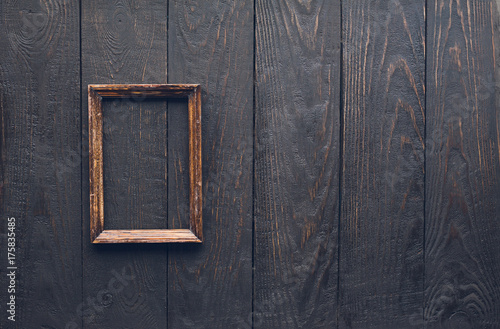 photo frame on old wooden wall