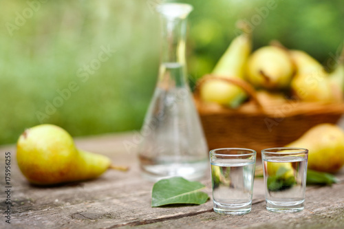 Two shot glass with pear liqueur drink