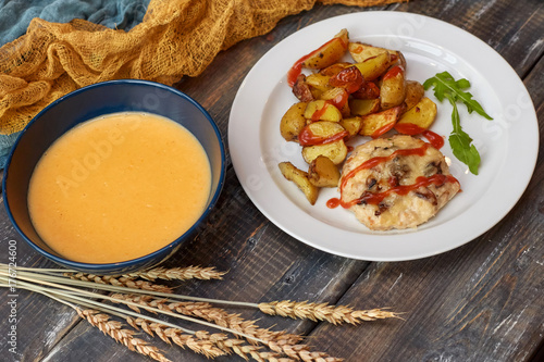 Fried potato with meat and pumpkin soup