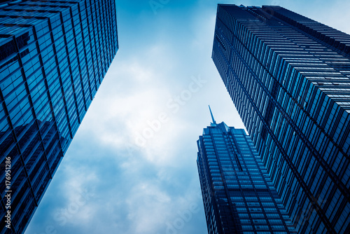 directly below of modern financial skyscrapers in central Hong Kong,blue toned,china.