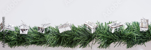 Christmas decoration with copy space. Christmas garland with silver gift boxes