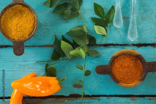 Various spices and herbs on wooden table