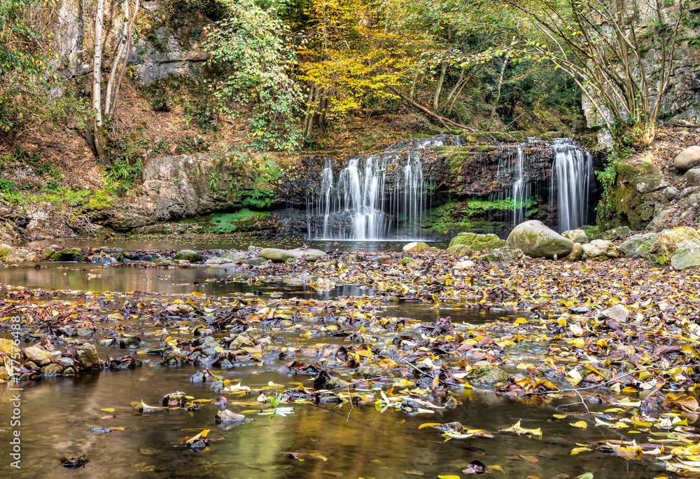 Waterfall on the Margorabbia torrent of Ferrera di Varese on autumn, Italy 