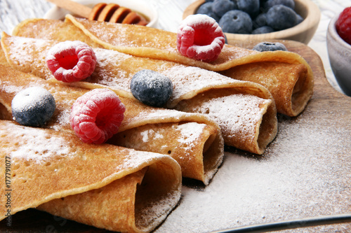 Delicious Tasty Homemade crepes or pancakes with raspberries and blueberries