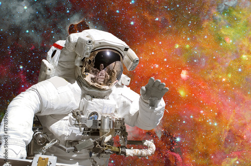 Astronaut in outer space. Galaxy and stars on the background.