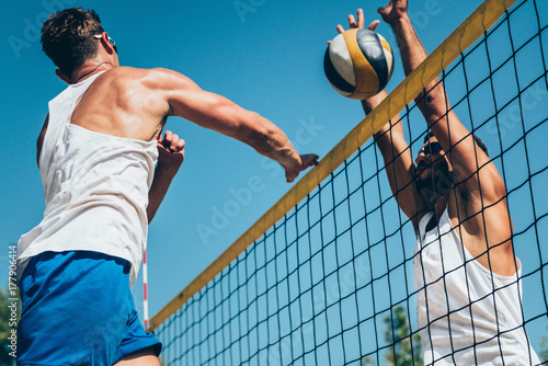 Beach volleyball detail - Males on the net