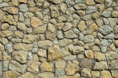 the wall is made of mountain stones