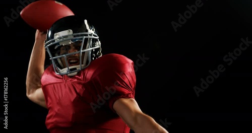 American football player throwing the ball 
