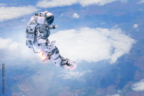 Spaceman on flying board. Mixed media