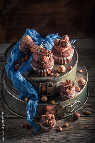 Sweet chocolate cupcake made of cream and nuts