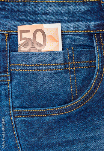 Fifty euro bill in small pocket of jeans.