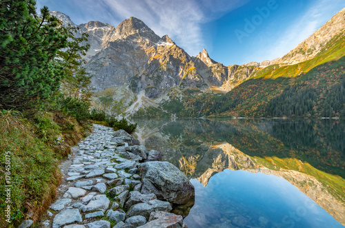 Tatra mountains, footpath and Morskie Oko lake, fall morning, Poland