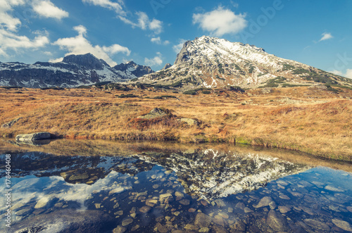 Tatra mountains, Kozi Wierch peak reflection in water, fall