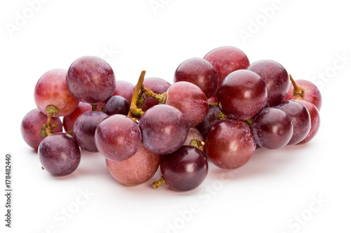 Ripe red grape isolated on white.
